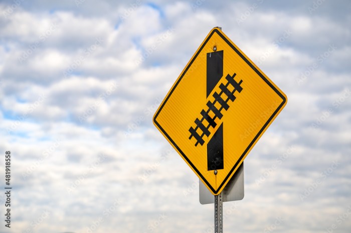 A skewed railroad crossing sign